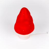 Red mushroom-shaped lamp on a white background